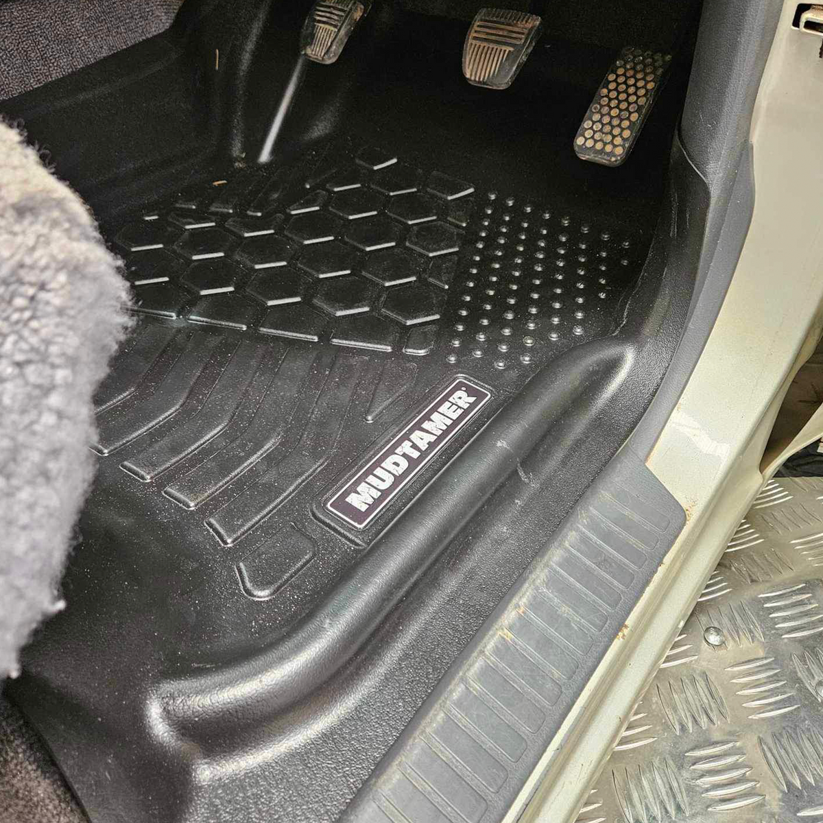 Front driver's side MUDTAMER mat installed in a Toyota Landcruiser 80 Series